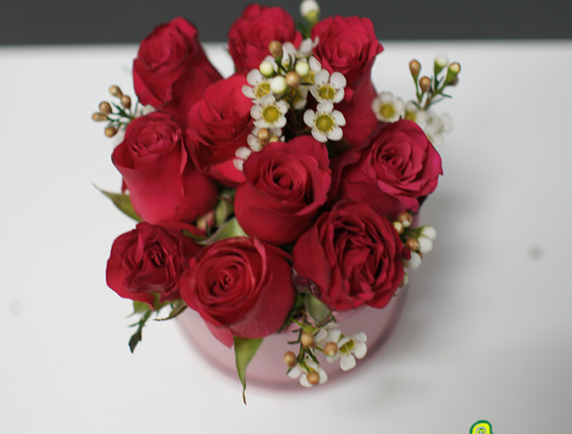 Box with roses and waxflower photo